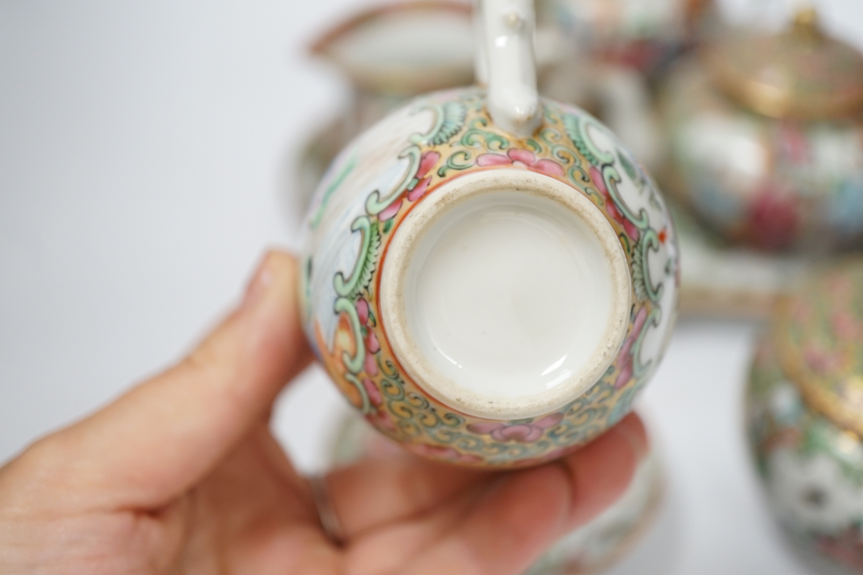 A 19th century Chinese famille rose teaset including a trefoil shaped tray, two teapots, sugar bowl, jug and cup with saucer, teapot 10cm high (6)